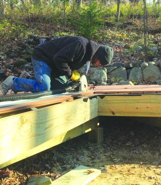 A track saw was used to trim straight sections of decking.