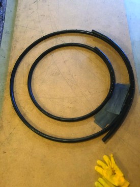 The author screwed black plastic pipe to MDF backing.