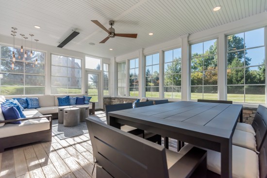 Create an outdoor room for all seasons with Trex RainEscape and protective screens or windows.