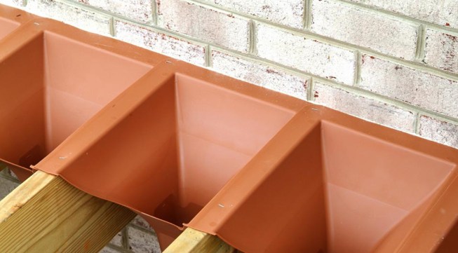 Trex RainEscape funnels are easy to install.