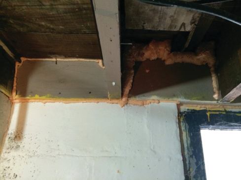 The rim joists were air-sealed well. But see the mold on the concrete-block wall that had been painted only months before the photo was taken.