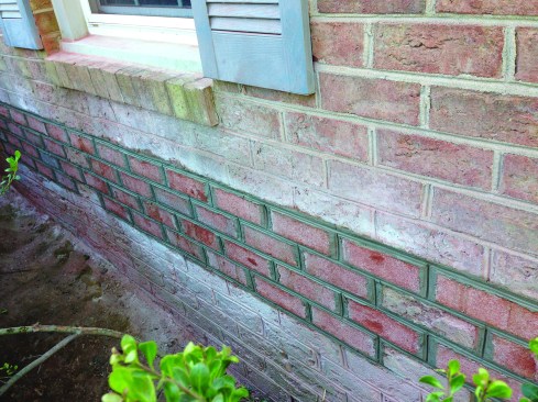 Then he tucked it up behind the existing weather-resistive barrier that covered the sheathing behind the brick.