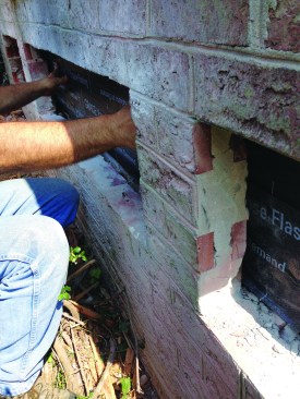 Before the finish brick was replaced, the author applied a flashing membrane to the new rim joist.