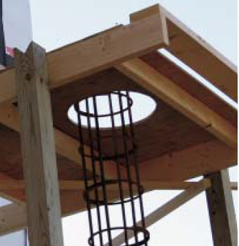 Temporary scaffolding provided a work platform from which to place the concrete, as well as a convenient support for the tube form.