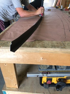 A step that was needed to form the drip edge to match the curved eaves of the turret. First, though, a metal brake was used to slit a 10-foot length of 650mm coil stock to 3 1/4-inch widths with 1-inch legs on each section, followed by shrinking/stretching guided by lines scribed to Ram Board to represent the curved eaves.