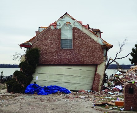In what has become a classic failure mode, the upper corners of this garage have rotated, unable to withstand the lateral force of strong winds (note the bad location of the panel joint at the upper right hand corner).