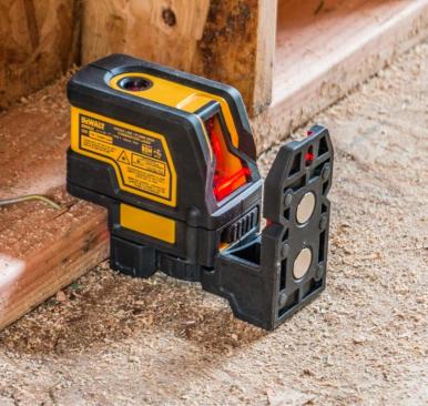 A notch in the front of the housing allows you to bring the down dot in line with the edge of a 2-by plate. If the wall is plumb at this location the dot projected from the top of the tool will just kiss the edge of the top plate.