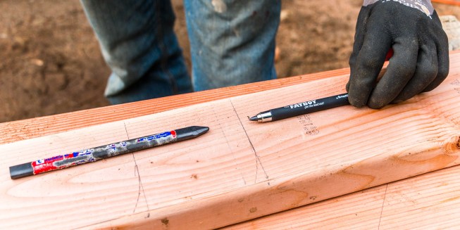 The SuperPencil is on top of the line it drew, while the FatBoy is pointing at the line it drew.