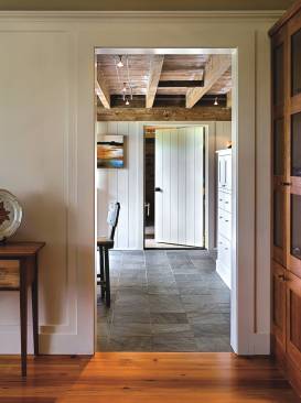 Wide doorways with zero thresholds meld seamlessly with the traditional architecture.