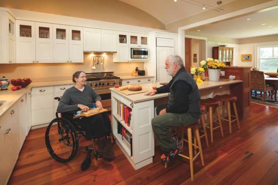 The kitchen features wide aisles, plenty of natural light, and a island that permits seated meal preparation.