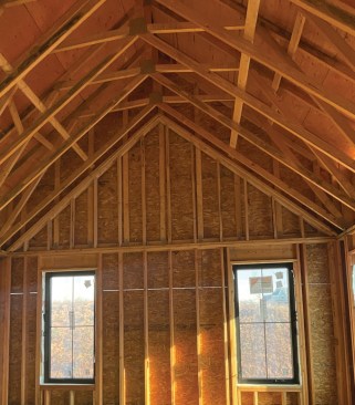 Weak hinge. A stacked gable end wall in a vaulted ceiling creates a “hinge” point in the wall that may provide inadequate resistance to wind loads. To avoid this condition, tall walls should be balloon framed.
