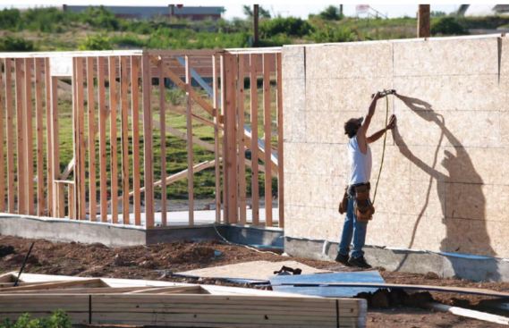 Code requires nailing along all edges of braced wall panels. This may require blocking between studs on tall walls or when panels are run horizontally. (photo: Chris Ulster)