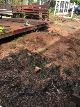 After the tree and the center section of the deck had been removed, only the undamaged upper level of the deck remained.