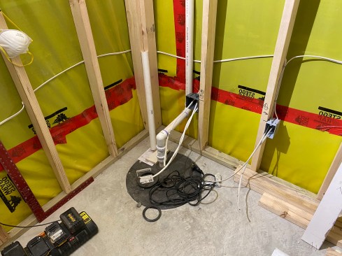 The author used 15-mil Stego Wrap secured by a termination bar. The interior drains run to the sump pump.