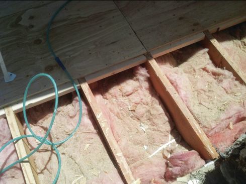 When a deck is being framed for a waterproof roof covering, solid blocking between joists is required to support plywood edges and prevent deflection.