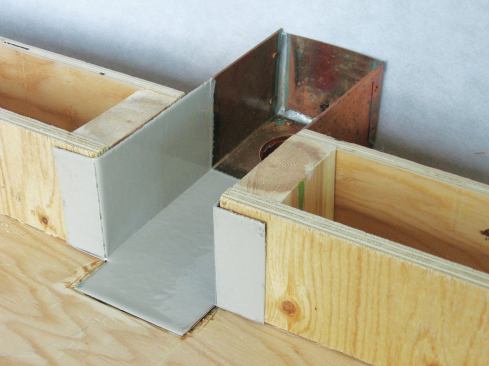 Duradek’s copper scupper box is coated with PVC so that the deck membrane can be heat-welded to it, making the assembly watertight. 