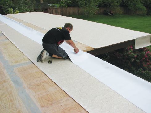 Multiple pieces of vinyl membrane are needed to cover wide decks. 