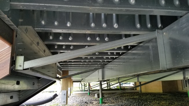 Diagonal bracing was installed on the lower deck to solve a pesky vibration problem in the steel deck framing.