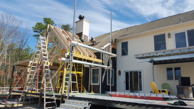 Support columns for the sunroom bear either on the house foundation or directly on piers.