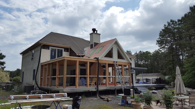 The structure was timber-framed with a combination of pressure-treated sawn and engineered lumber.