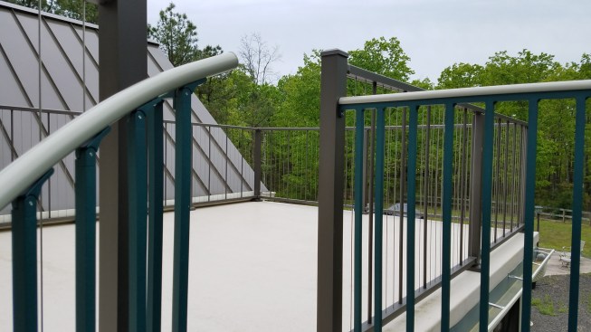A subcontractor installed waterproof fiberglass walking surfaces on the two upper decks.