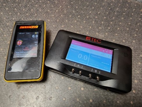 Two digital manometers : Retrotec DM32 (above, at left) and The Energy Conservatory DG-1000 (above, at right).