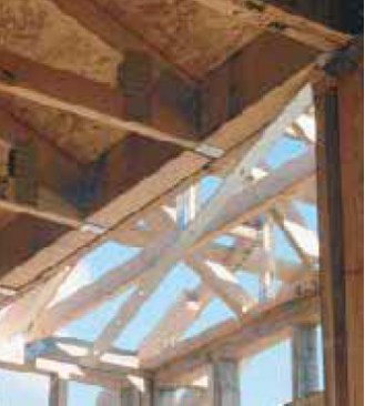 The installation of a blocked girder trus acts as the collector for a section of roof.