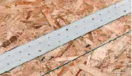 This strap was nailed to blocking below through the floor sheathing.