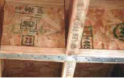 This collector was assembled from wood I-joist blocks and strapping. Ideally, the ends of the I-joist block webs would bear solidly against web fillers in the floor joists.