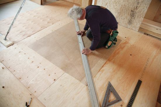 I tacked the panel to an area of floor where I could work freely around all sides.