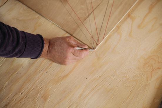 From one corner of the template, I drew radial riser lines at 22.5-degree increments.