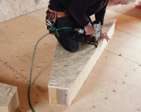 … kneeling on the box to eliminate gaps and secured it with finish nails.