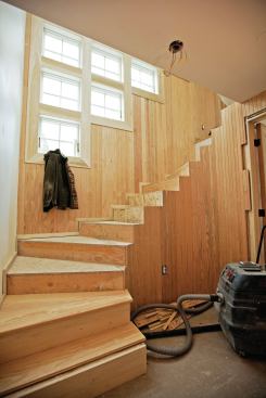I finished the front side of this wall with vertical 1x3 T&G fir, which knuckled around the curves as if custom-made for the job.