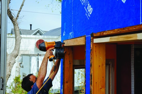 Pollard furred the face of the header out with plywood to match the plane of the existing sheathing.