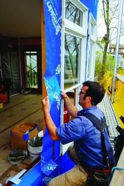 Next, he applied a strip of VP 100 to the side of the window.