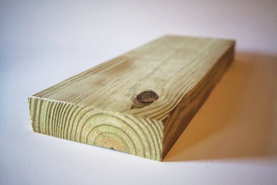 Even though the bark side of this decking has a knot, it should still be installed facing toward the weather.