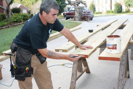 End cuts and bolt holes in pressure-treated decking and framing should always be re-treated with a wood preservative prior to installation. Sealing the ends of the boards with a penetrating oil will help block moisture absorption through the end grain, which will limit cracking and checking.