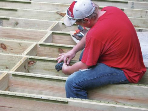 When the deck design requires hidden fasteners, the author uses Grabber’s Deckmaster brackets, which are available in both powder-coated (shown) and stainless steel versions.