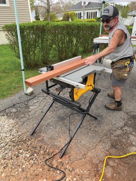 The author first ripped a pair of kerfs in the undersides of the 2x4 red balau mahogany rails.
