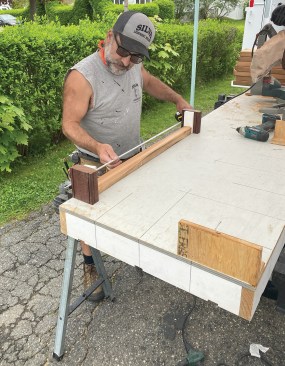 The author checks the baluster length with the mock-up blocks.