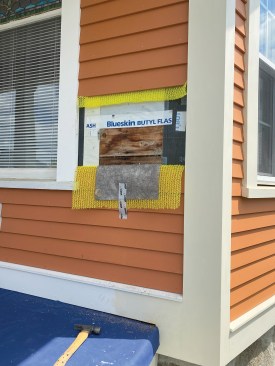 Where upper rails are fastened to the house, the author removed siding and cut back drainage mat, WRB, and board sheathing to install blocking.