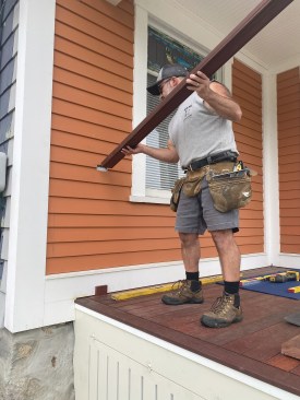 He left a small gap below the rail for drainage (and later sealed the tops of the rails to the siding with sealant).