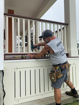 The author fastened the baluster assemblies to the rails with trim screws driven through oversized pilot holes, which he later capped with Starborn PVC trim plugs.