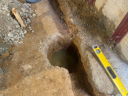 Interior to the steel, the crew excavated for perimeter drains.