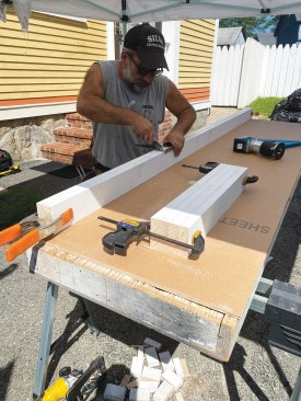 I made the frames out of three 16-foot lengths of primed 5/4x4 stock, cutting all of the pieces for both tables to length at the same time. Before assembling the frames, I clamped the four long stiles (two for each table) and eight shorter rails (two end rails and two intermediate rails per table) together and laid out the locations for approximately 1 1/2-inch-wide slots in the edges of the stiles and rails. By simply aligning my cut line with the slots, I can make cuts either along or across the frame without making saw kerfs in it. Of course, eventually the edges of the frame will be riddled with saw kerfs, but as long as they aren’t too deep, they won’t affect the frame’s integrity.