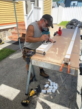 I used a router with a straight bit to make the slots 1/2 inch deep, first scoring the layout lines with a utility knife to prevent blowing out the edges of the 5/4 stock.