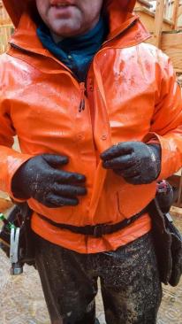 The jacket has a double-fabric front flap, a packable hood, and Napoleon pocket with YKK zipper and hole for head phones.