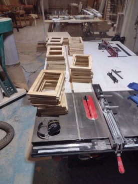 By making all the boxes the same size, the author saved on materials and construction time.