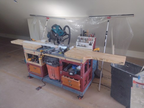 With the system set up as a miter station, the holddown clamps keep everything secure, including tall and short drawers, open storage, and dust collection, all in a single mobile unit.