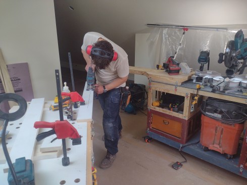 Here, the author uses the holes in the worktop for his holddown clamps. The author's system is not just a pile of boxes for holding tools. They provide work surfaces for a multitude of tasks.